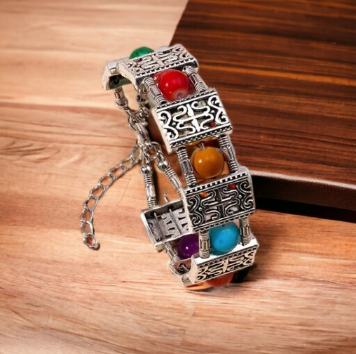 Zilverkleurige schakel armband met 6 gekleurde kralen