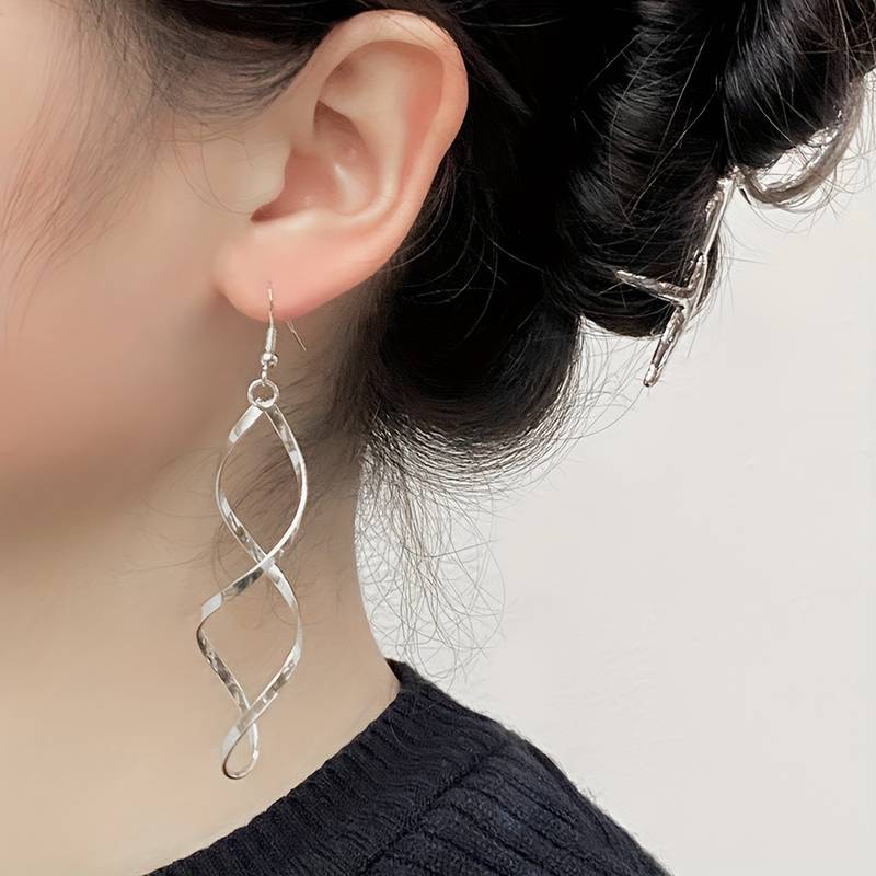 Zilverkleurige Oorbellen met Spiraalontwerp - Sieraden - Spiritueelboek.nl